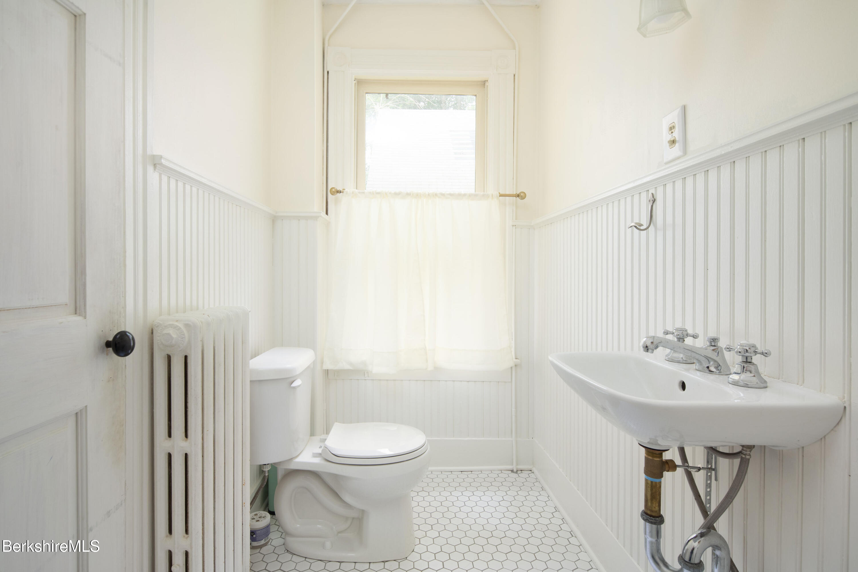 77 Grove Street Great Barrington, MA 01230 - Photo 17 of 31 a bathroom with a sink a toilet and shower