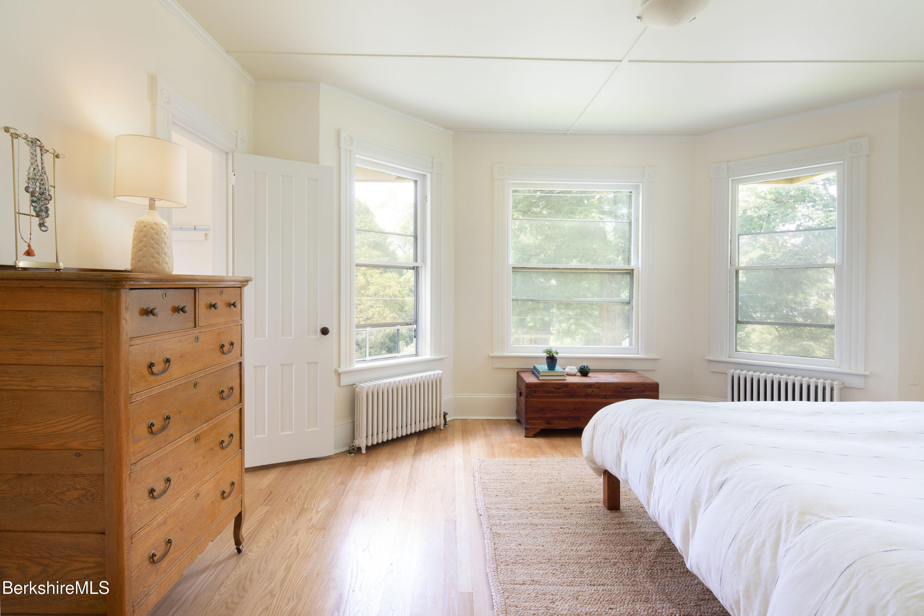 77 Grove Street Great Barrington, MA 01230 - Photo 21 of 31 a spacious bedroom with a bed and wooden floor