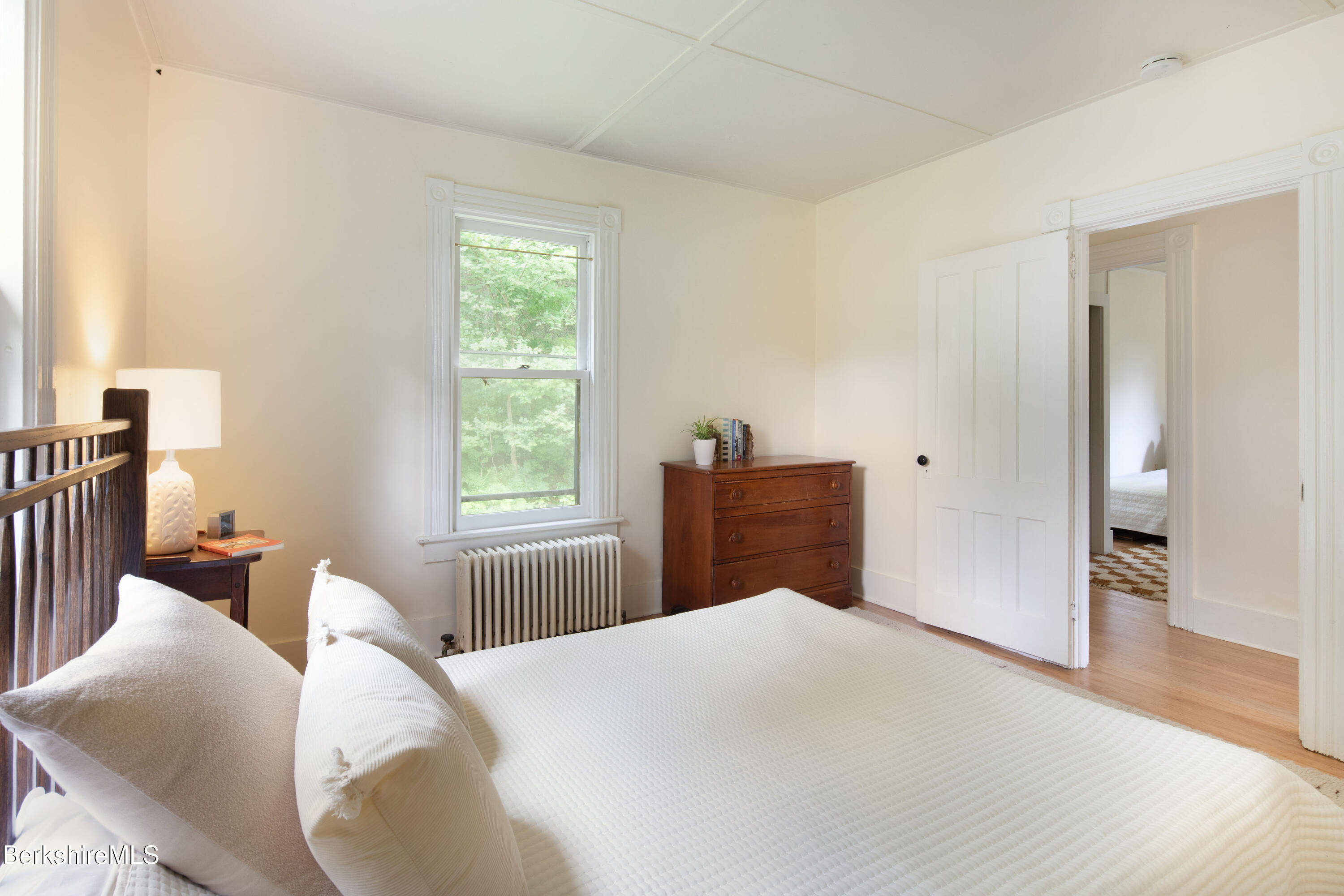 77 Grove Street Great Barrington, MA 01230 - Photo 23 of 31 a bedroom with a bed and wooden floor