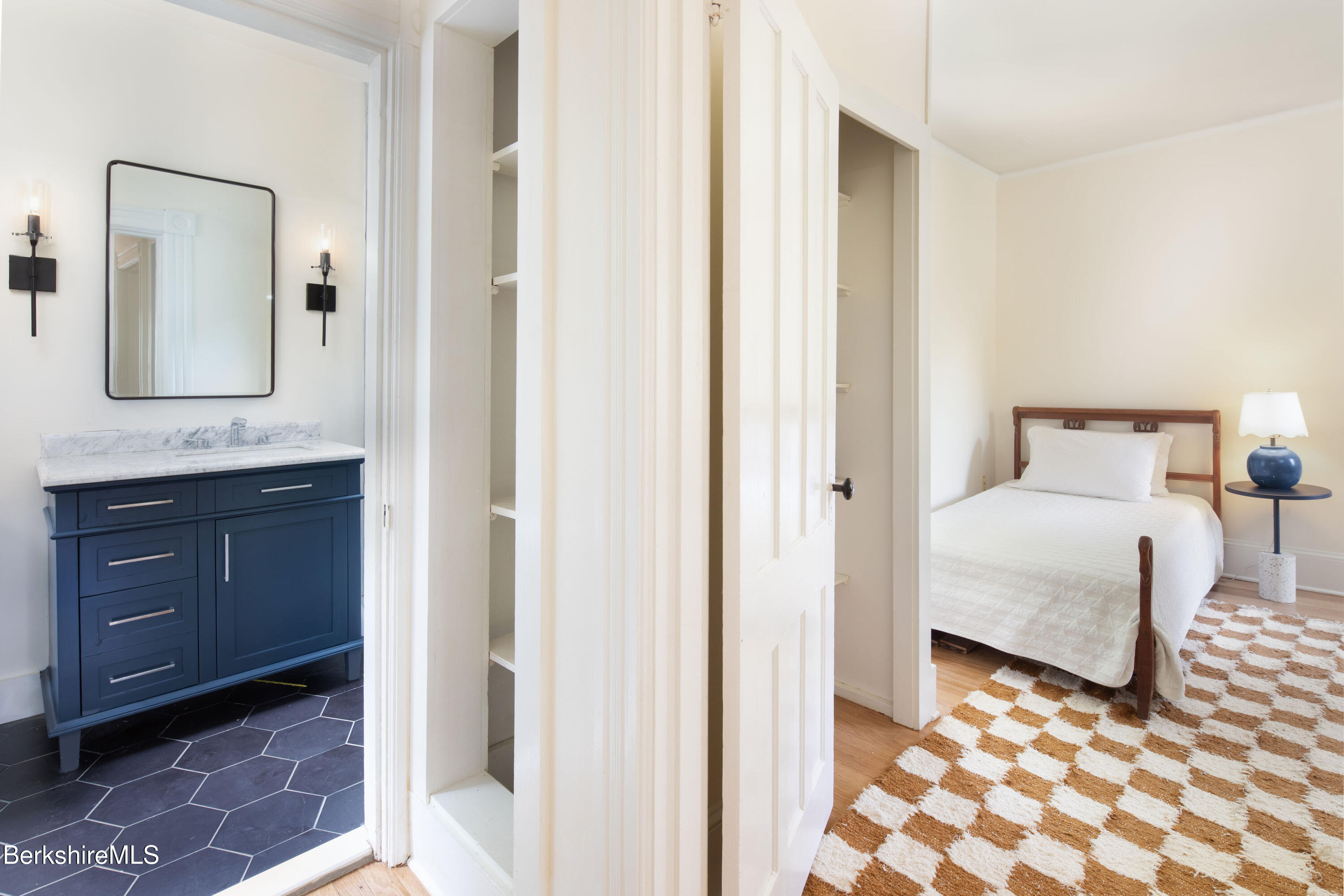 77 Grove Street Great Barrington, MA 01230 - Photo 25 of 31 a bedroom with a bed and a mirror