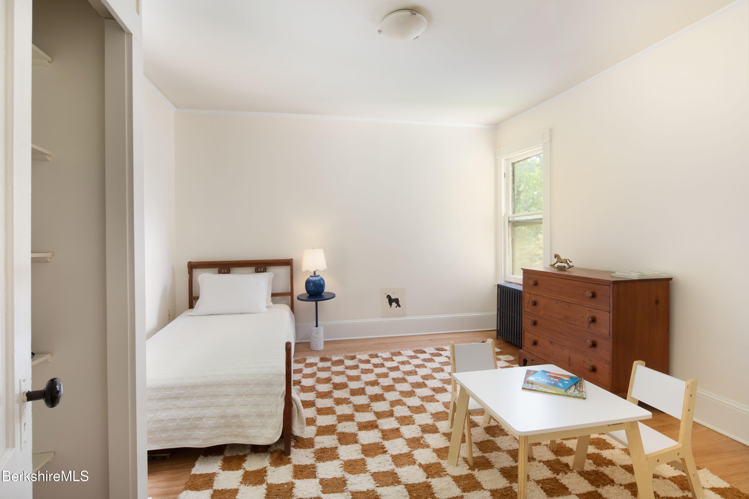 77 Grove Street Great Barrington, MA 01230 - Photo 26 of 31 a bedroom with a bed and wooden floor