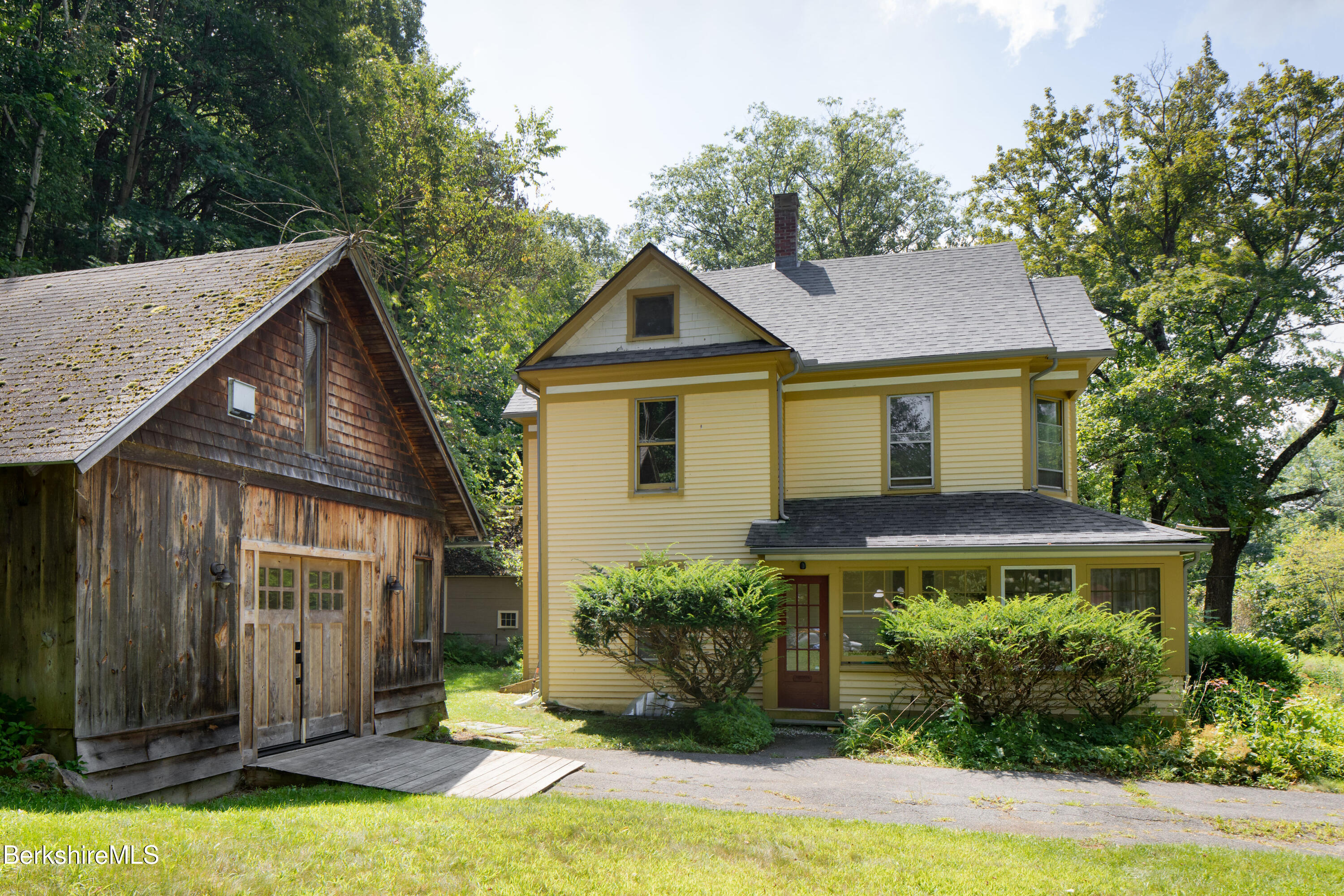 77 Grove Street Great Barrington, MA 01230 - Photo 28 of 31 a front view of house with yard and trees around