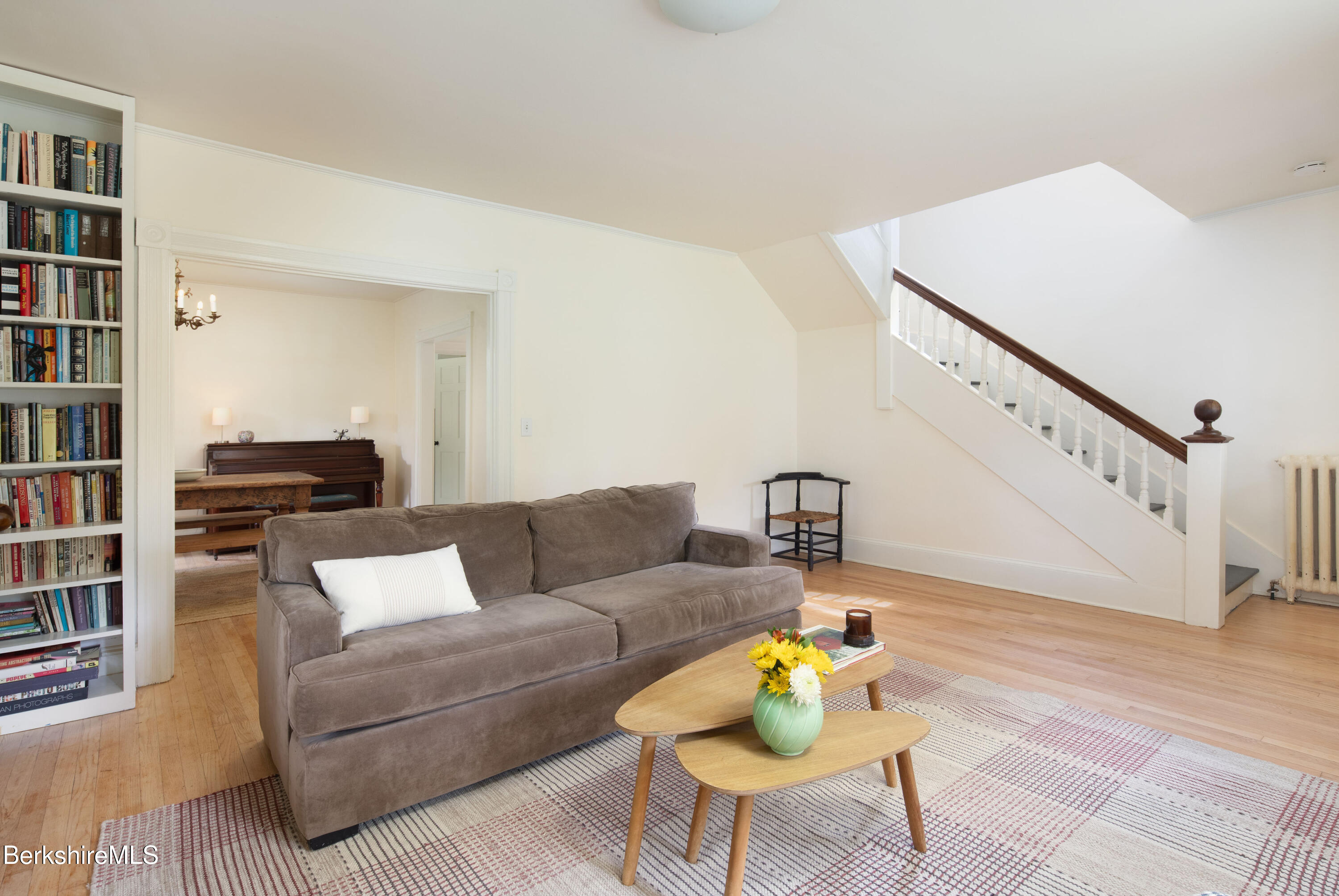 77 Grove Street Great Barrington, MA 01230 - Photo 8 of 31 a living room with furniture and a book shelf