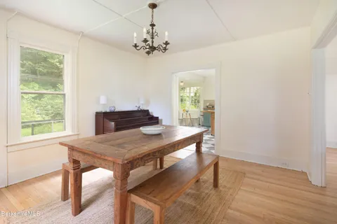 a view of a dining room with furniture and window