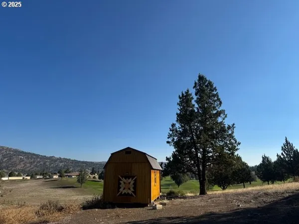 a view of a lake with a yard