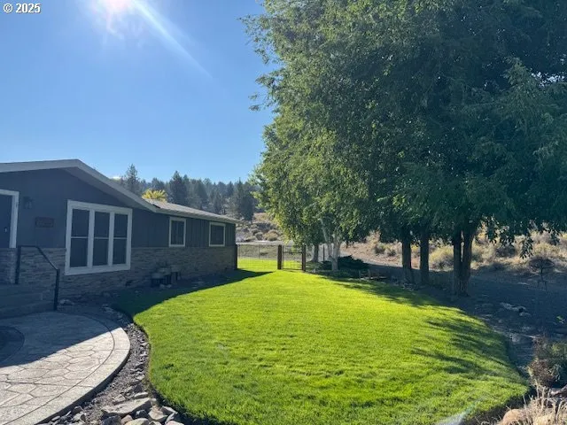 a view of a terrace with a table and chairs