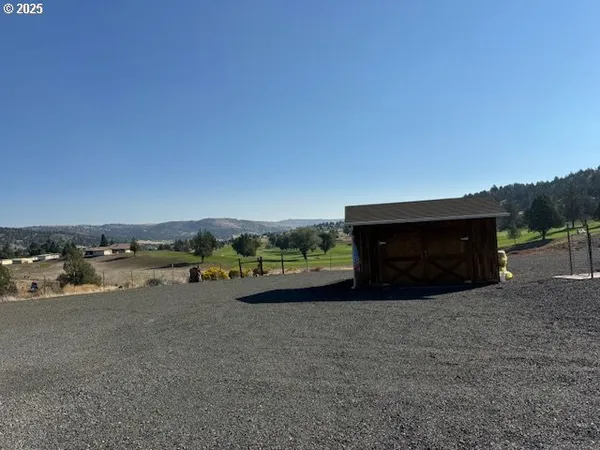 a house with trees in the background