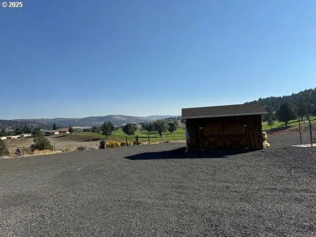 a house with trees in the background