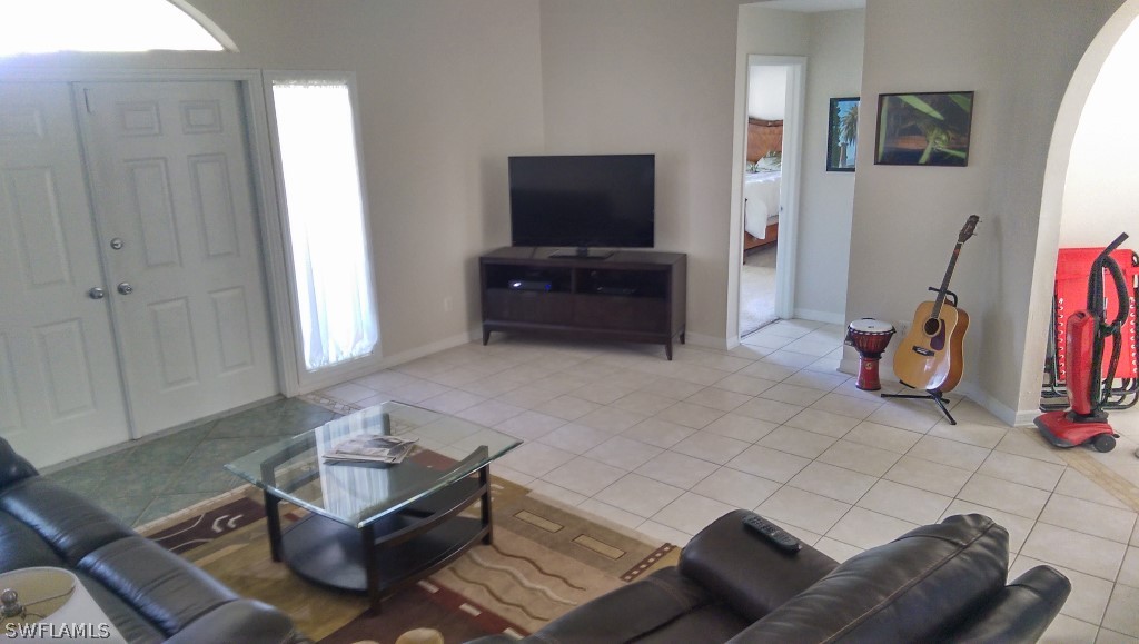 17501 Butler Road Fort Myers, FL 33967 - Photo 16 of 20 a living room with furniture and a flat screen tv