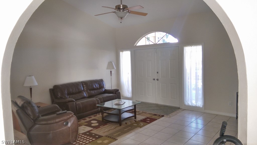 17501 Butler Road Fort Myers, FL 33967 - Photo 6 of 20 a living room with furniture and a chandelier