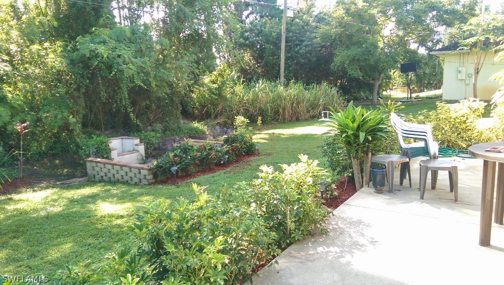 17501 Butler Road Fort Myers, FL 33967 - Photo 7 of 20 a garden view with a seating space