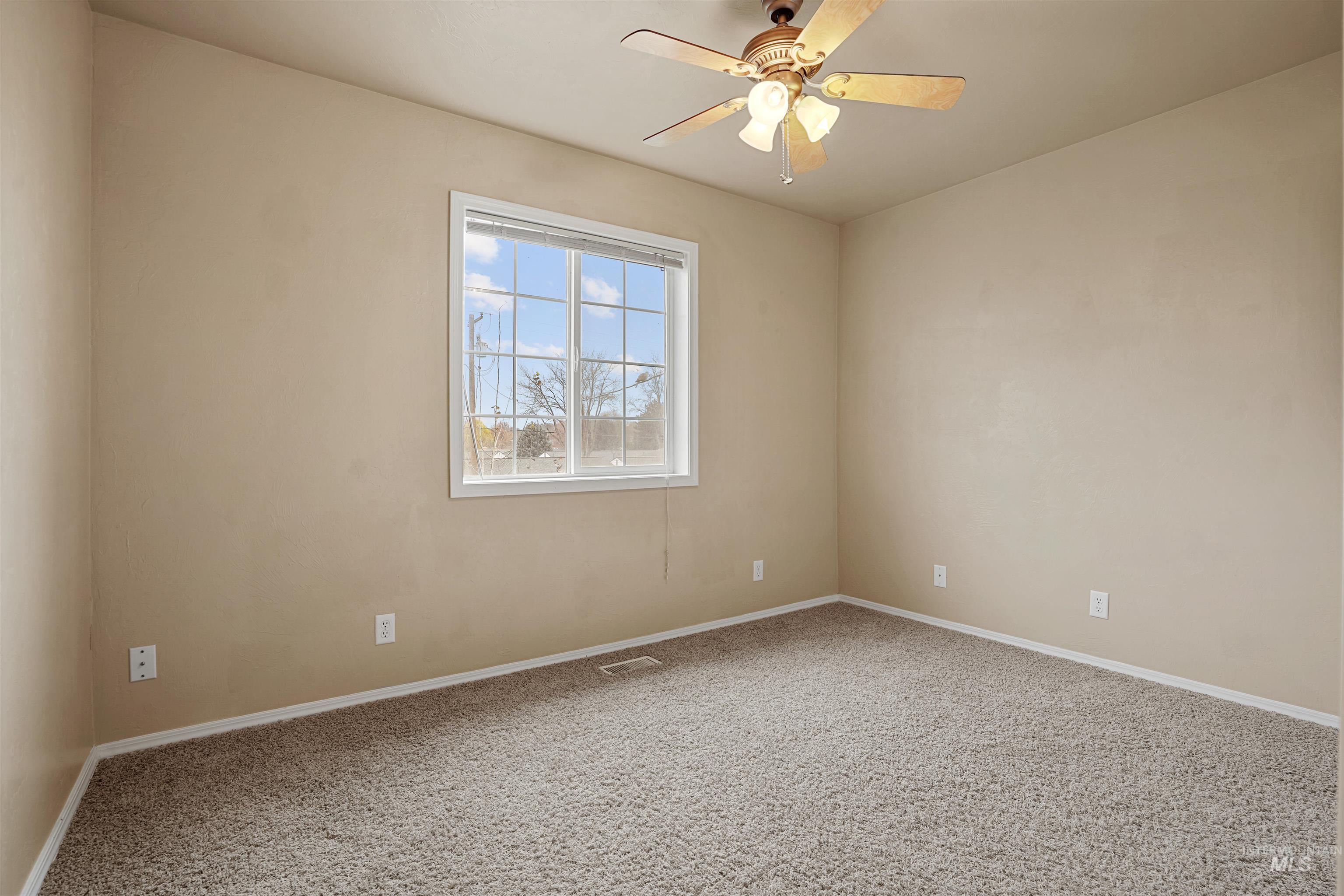 720 East Main Street Jerome, ID 83338 - Photo 20 of 50 Carpeted empty room featuring baseboards and a ceiling fan
