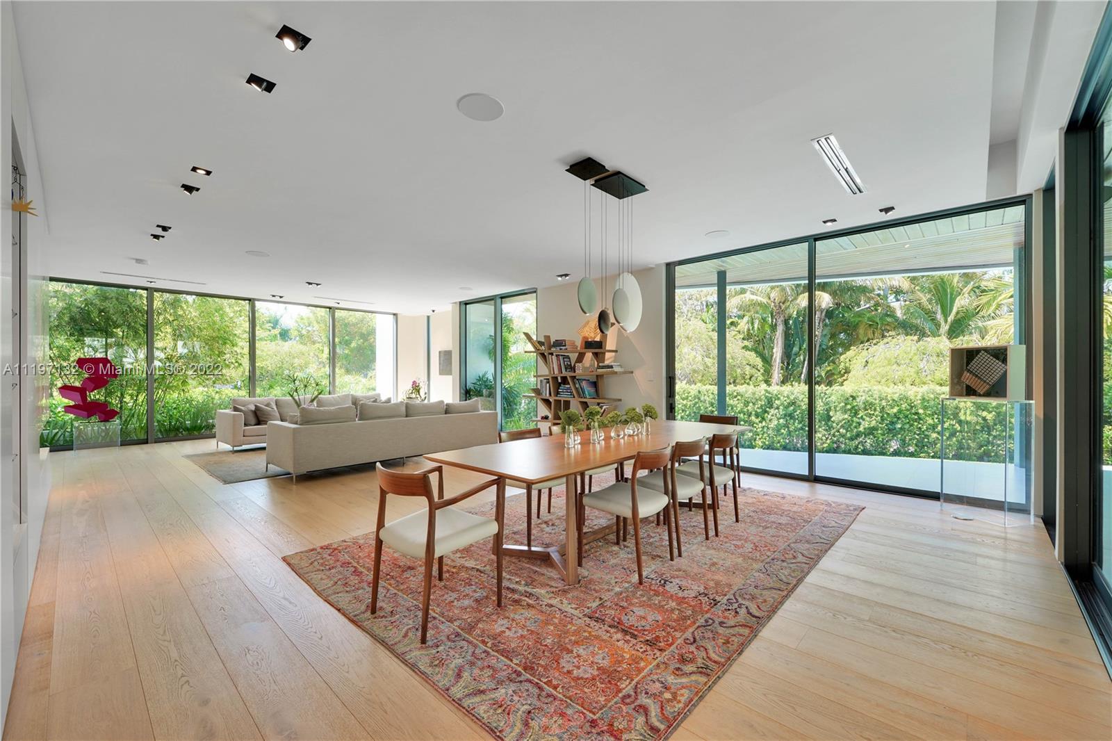 401 Ridgewood Road Key Biscayne, FL 33149 - Photo 8 of 40 a living room with furniture and a large window
