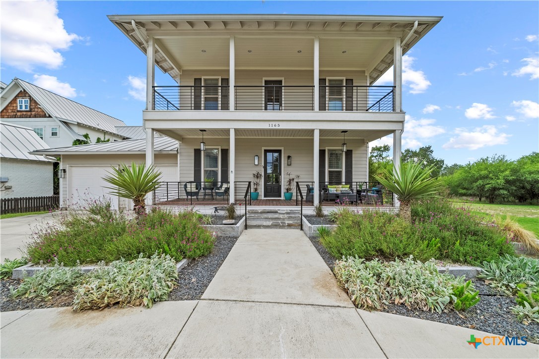 1165 Turtle Trail New Braunfels, TX 78130 - Photo 1 of 48 a view of a patio with table and chairs and potted plants