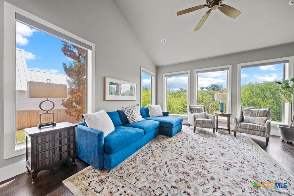 1165 Turtle Trail New Braunfels, TX 78130 - Photo 12 of 48 a living room with furniture and a large window