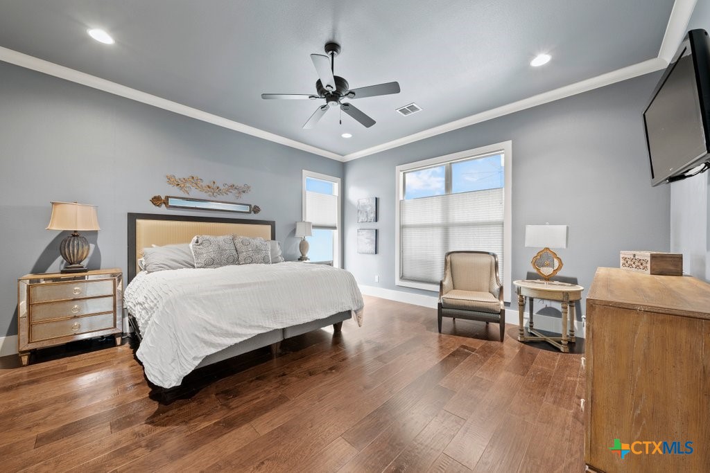 1165 Turtle Trail New Braunfels, TX 78130 - Photo 16 of 48 a bedroom with a bed and a large window