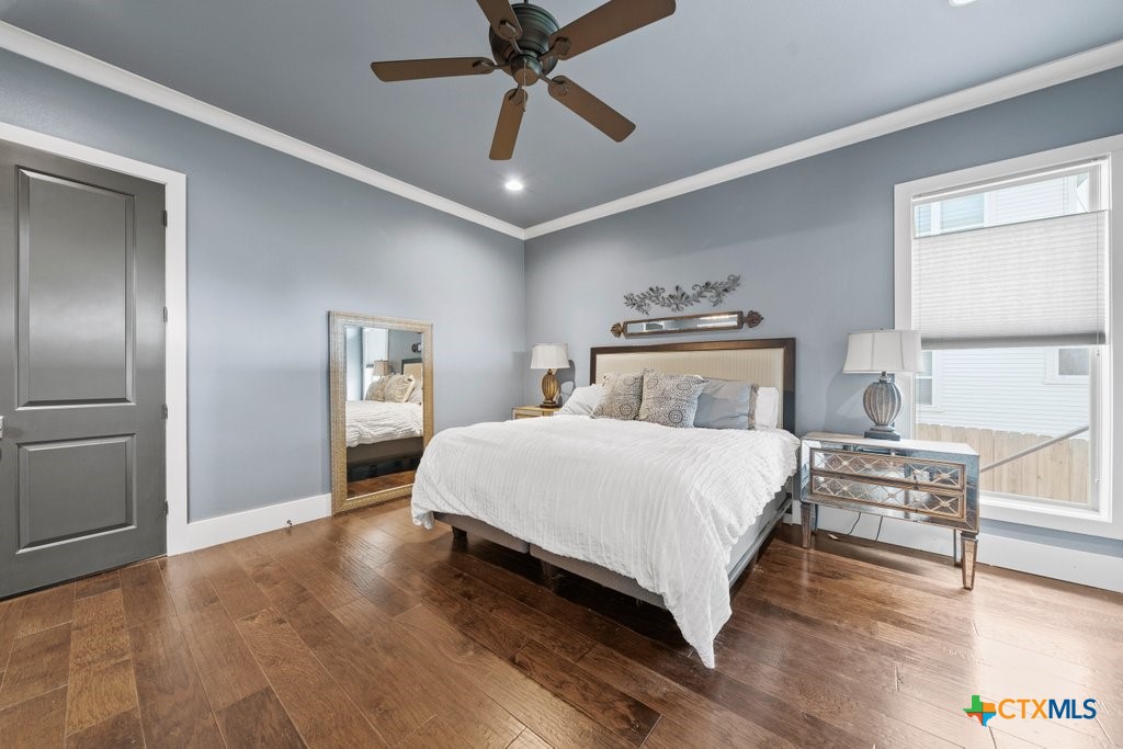 1165 Turtle Trail New Braunfels, TX 78130 - Photo 16 of 48 a bedroom with a bed and a chandelier