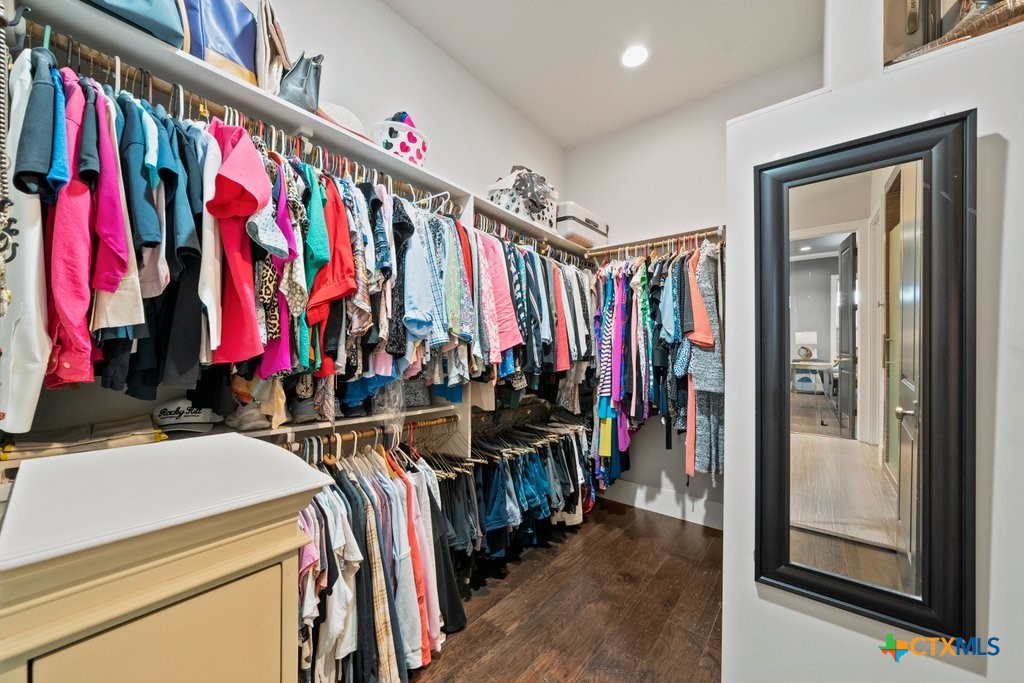 1165 Turtle Trail New Braunfels, TX 78130 - Photo 19 of 48 a view of walk in closet with clothes