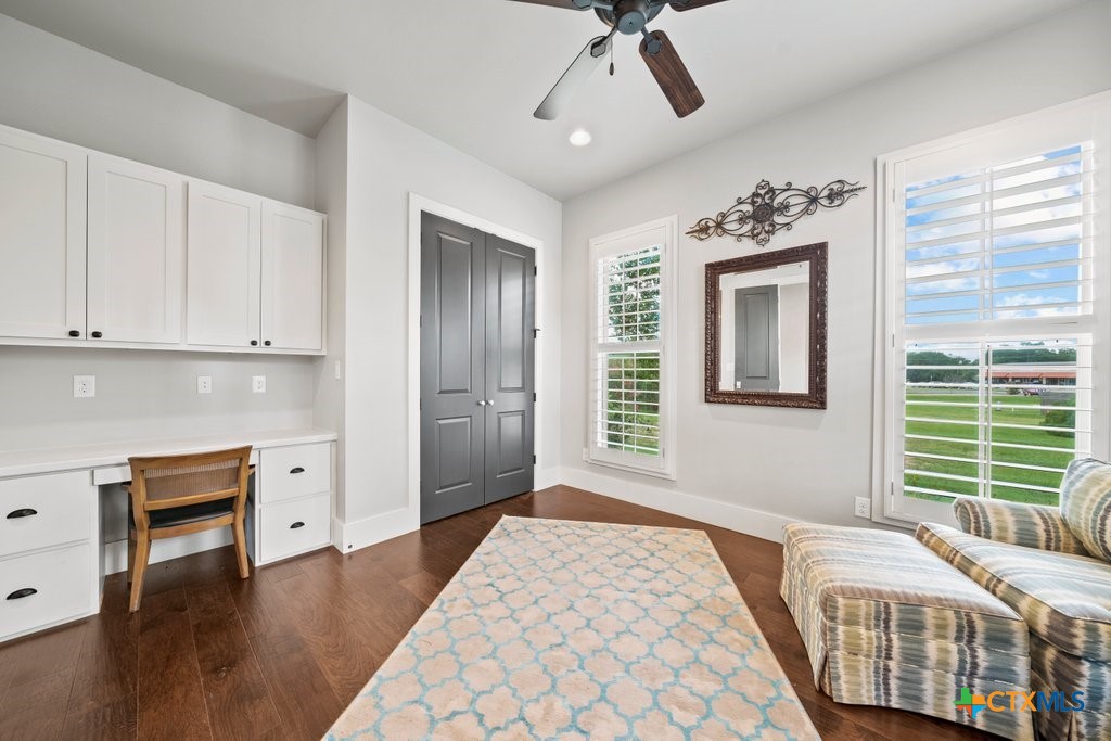 1165 Turtle Trail New Braunfels, TX 78130 - Photo 23 of 48 a bedroom with a bed and a chandelier