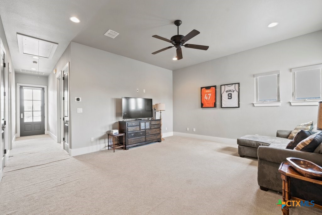 1165 Turtle Trail New Braunfels, TX 78130 - Photo 28 of 48 a living room with furniture and a flat screen tv