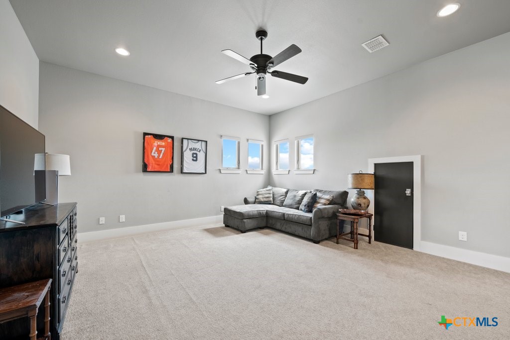 1165 Turtle Trail New Braunfels, TX 78130 - Photo 28 of 48 a living room with furniture and a flat screen tv