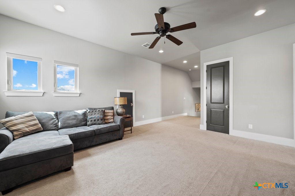 1165 Turtle Trail New Braunfels, TX 78130 - Photo 30 of 48 a living room with furniture and a ceiling fan