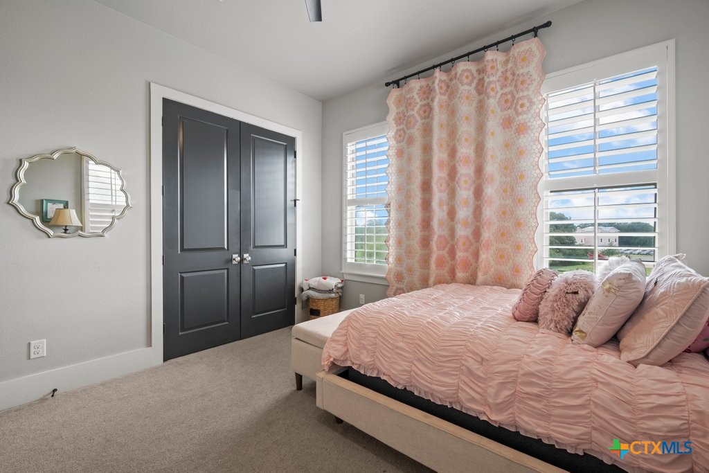 1165 Turtle Trail New Braunfels, TX 78130 - Photo 31 of 48 a bedroom with a bed bathroom and a window