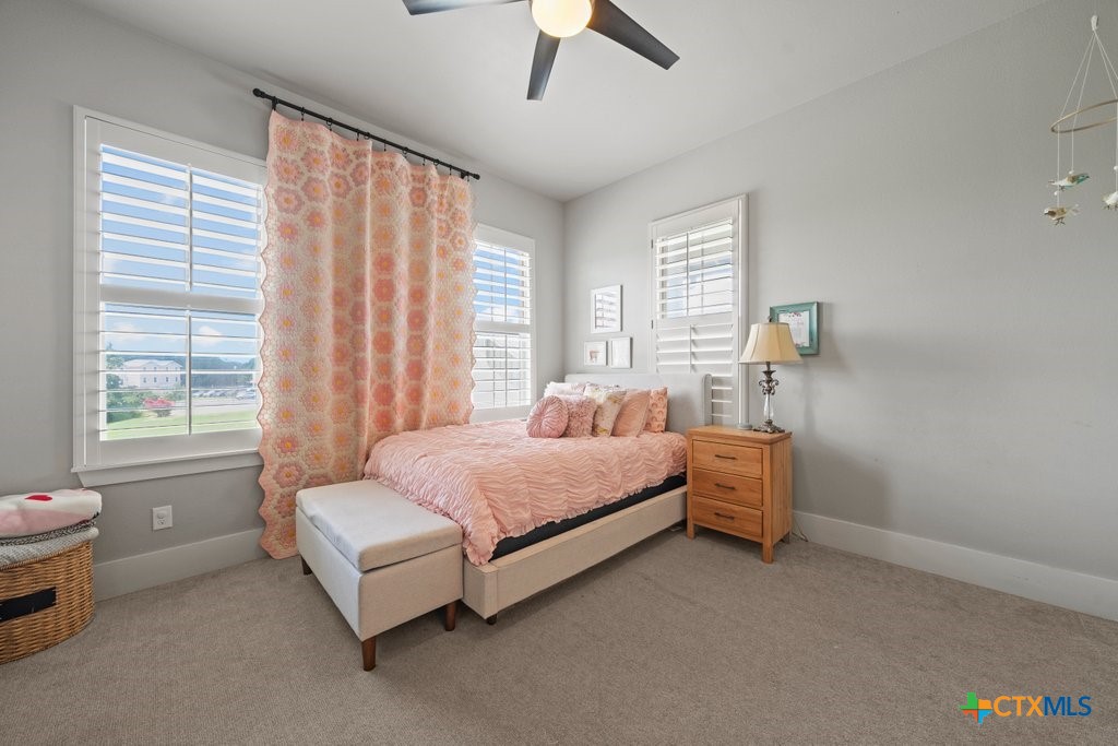 1165 Turtle Trail New Braunfels, TX 78130 - Photo 31 of 48 a bedroom with a bed and a window