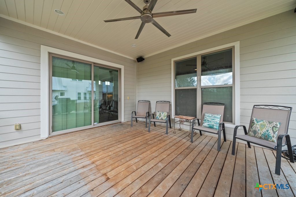1165 Turtle Trail New Braunfels, TX 78130 - Photo 40 of 48 a view of a patio with table and chairs and wooden floor