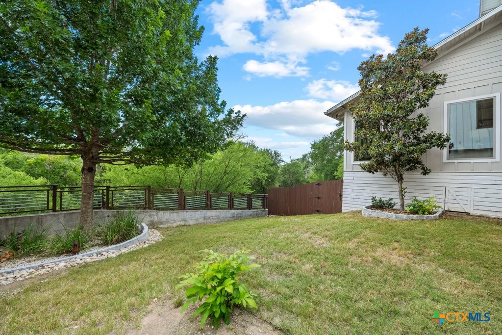 1165 Turtle Trail New Braunfels, TX 78130 - Photo 42 of 48 a house with lots of trees in the background