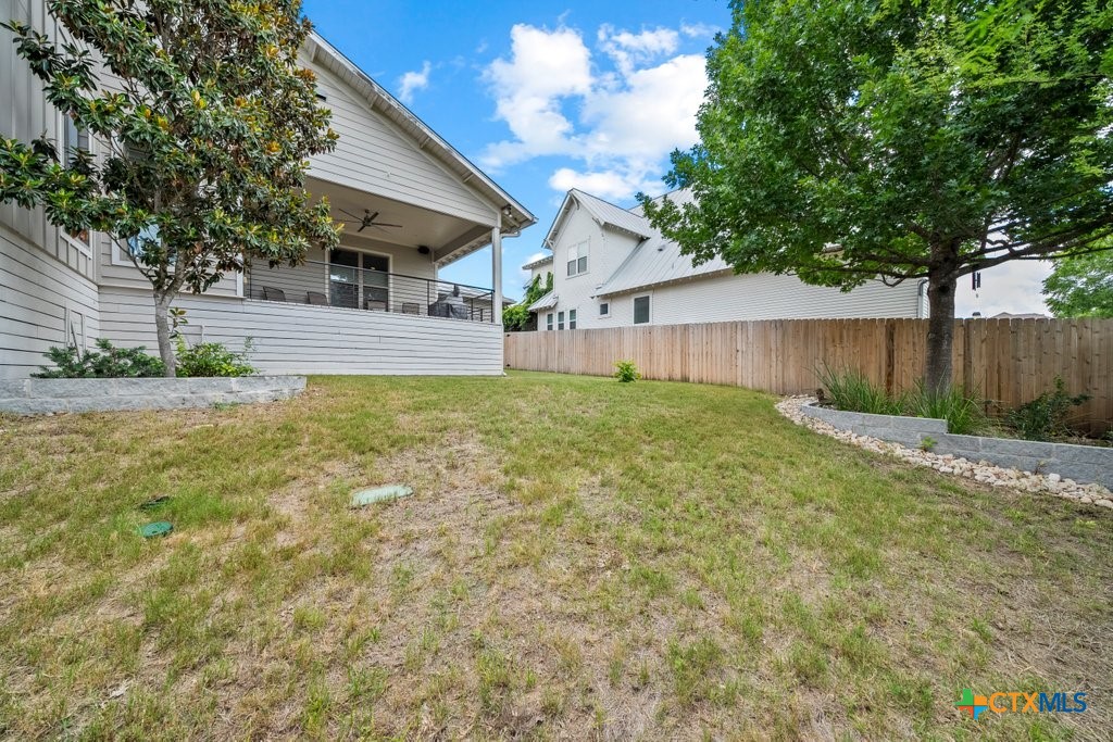1165 Turtle Trail New Braunfels, TX 78130 - Photo 43 of 48 a view of a back yard of the house