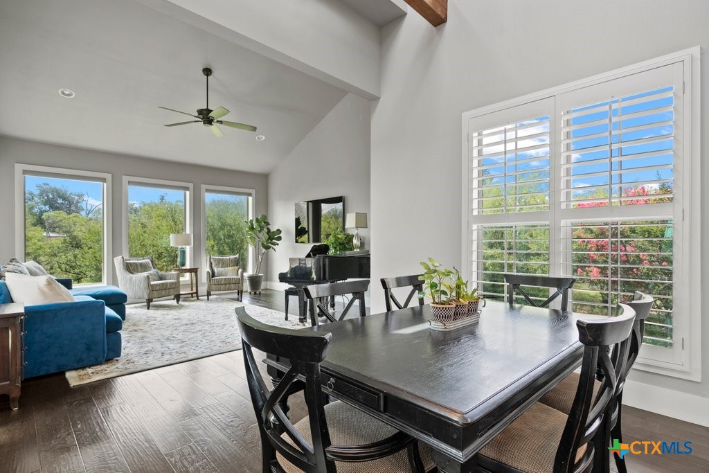 1165 Turtle Trail New Braunfels, TX 78130 - Photo 9 of 48 a view of a dining room with furniture window and wooden floor