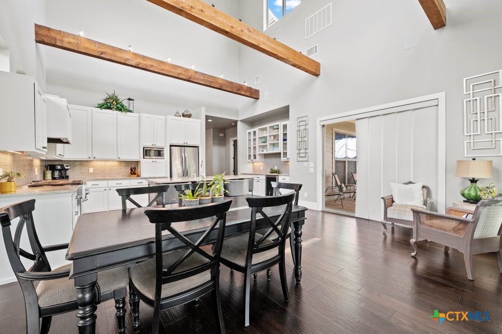1165 Turtle Trail New Braunfels, TX 78130 - Photo 10 of 48 a view of a dining room with furniture and wooden floor
