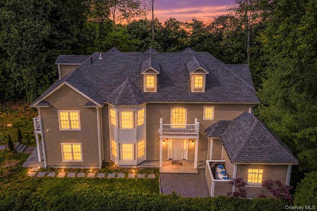 a aerial view of a brick house next to a yard