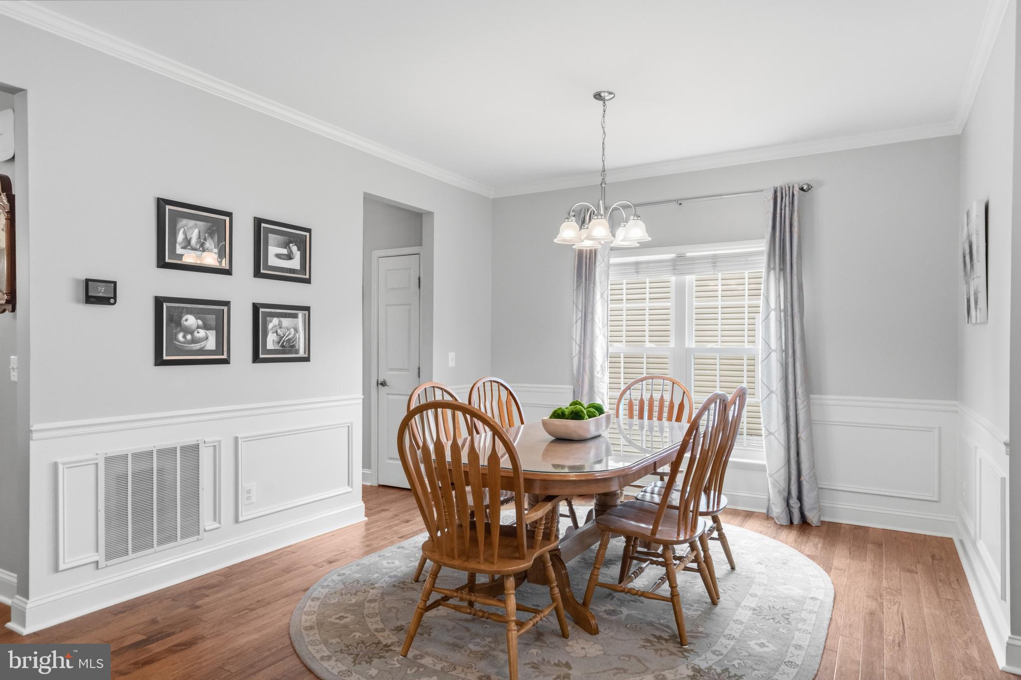21397 Springwell Drive Ashburn, VA 20148 - Photo 18 of 43 Formal Dining Room with Wainscoting