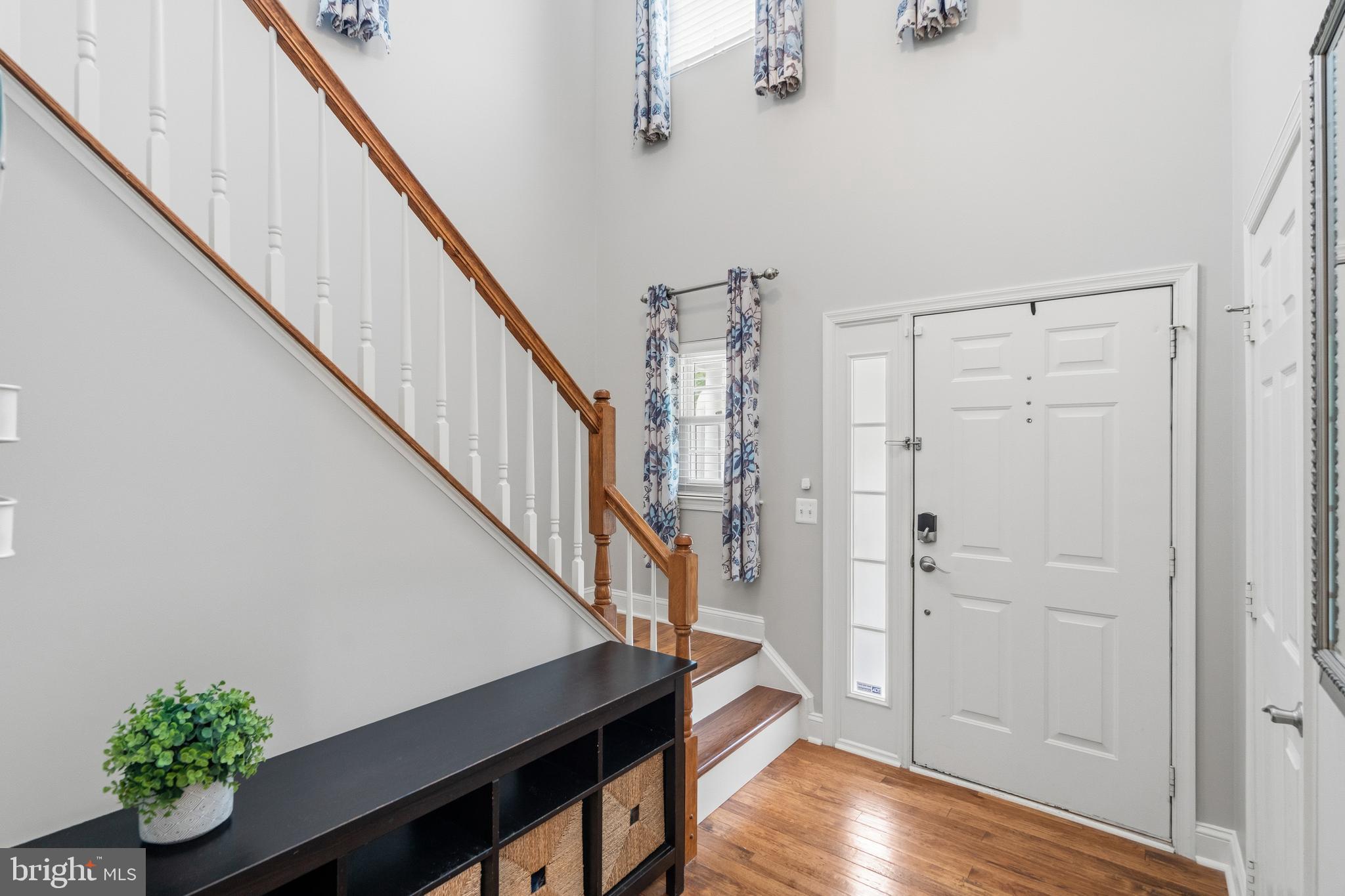 21397 Springwell Drive Ashburn, VA 20148 - Photo 20 of 43 Bright Foyer with Hardwood Stairs to Upper Level