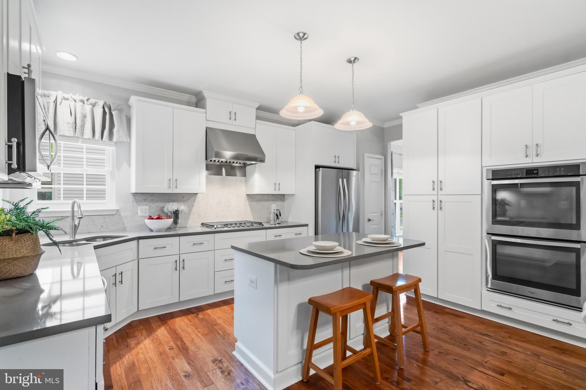 21397 Springwell Drive Ashburn, VA 20148 - Photo 7 of 43 Spacious Kitchen with Double Oven and Island