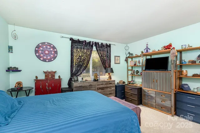 a bedroom with furniture and a bed