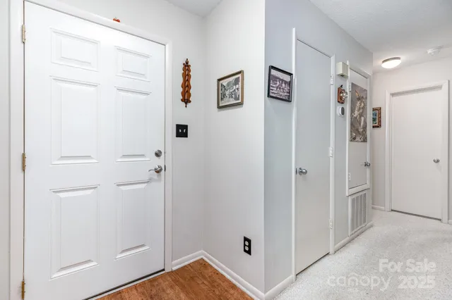 a view of a hallway with closet area
