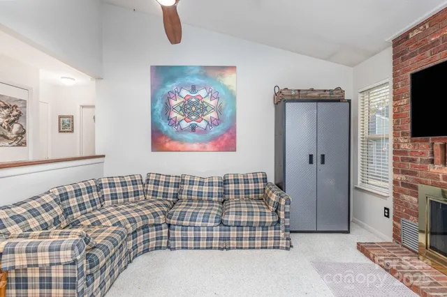 a bedroom with a bed and a fireplace