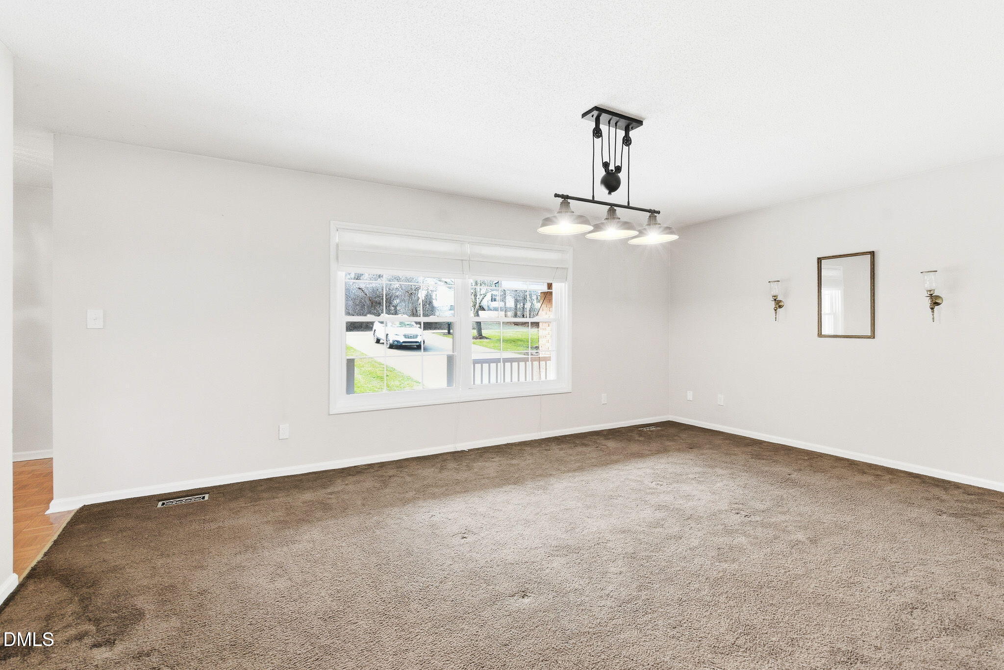 1836 Brier Lane Graham, NC 27253 - Photo 13 of 33 an empty room with windows and painted walls