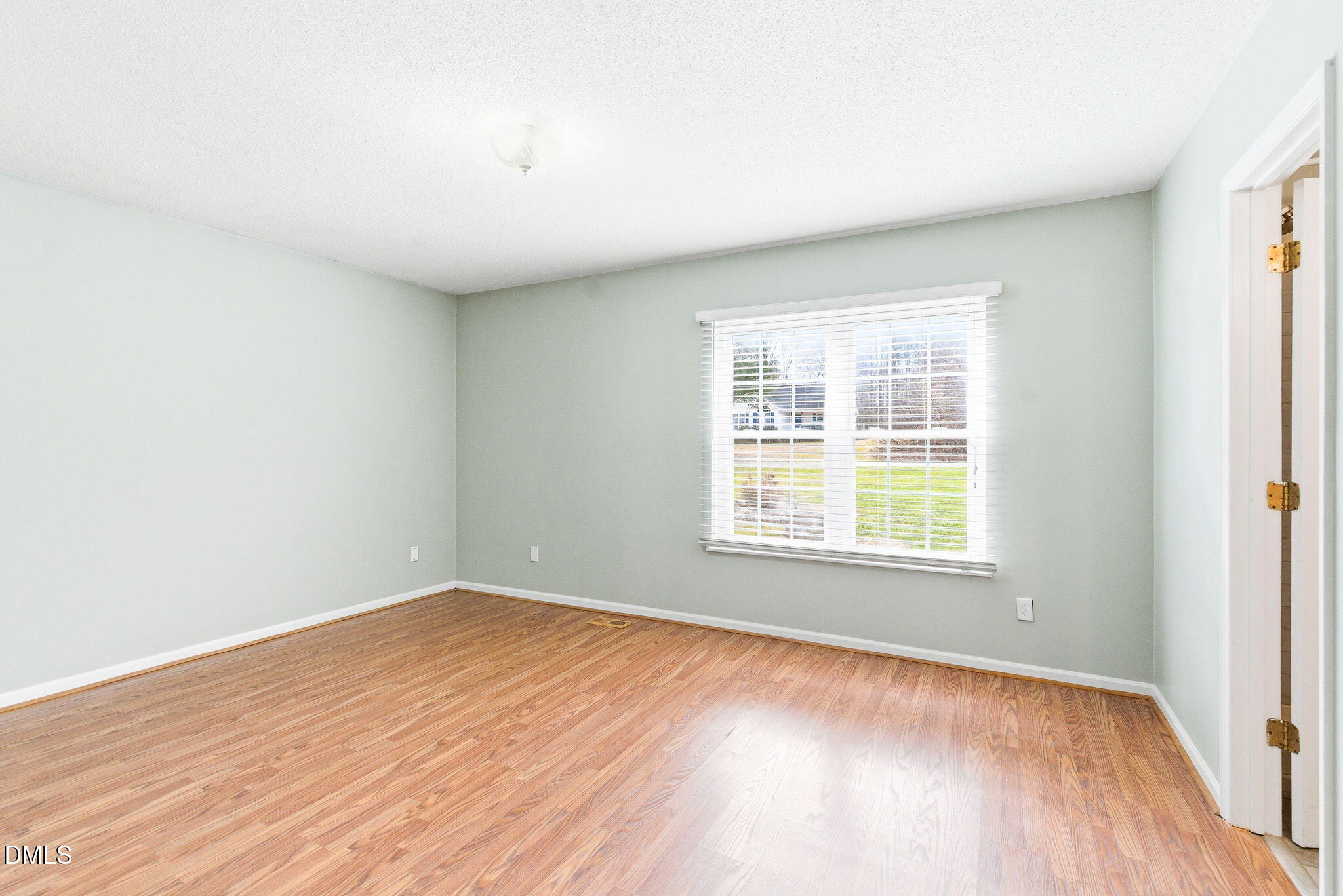 1836 Brier Lane Graham, NC 27253 - Photo 16 of 33 an empty room with wooden floor and windows