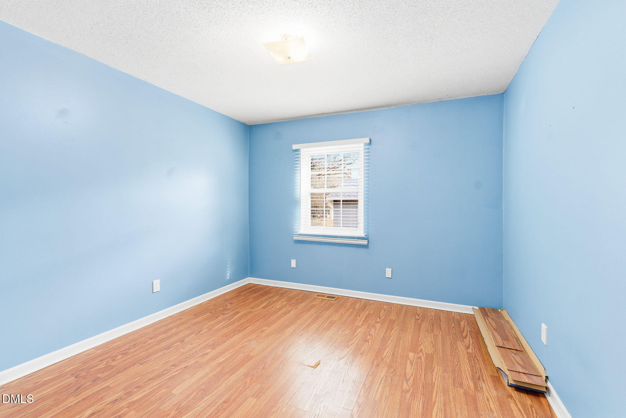 1836 Brier Lane Graham, NC 27253 - Photo 20 of 33 a view of a big room with wooden floor and windows