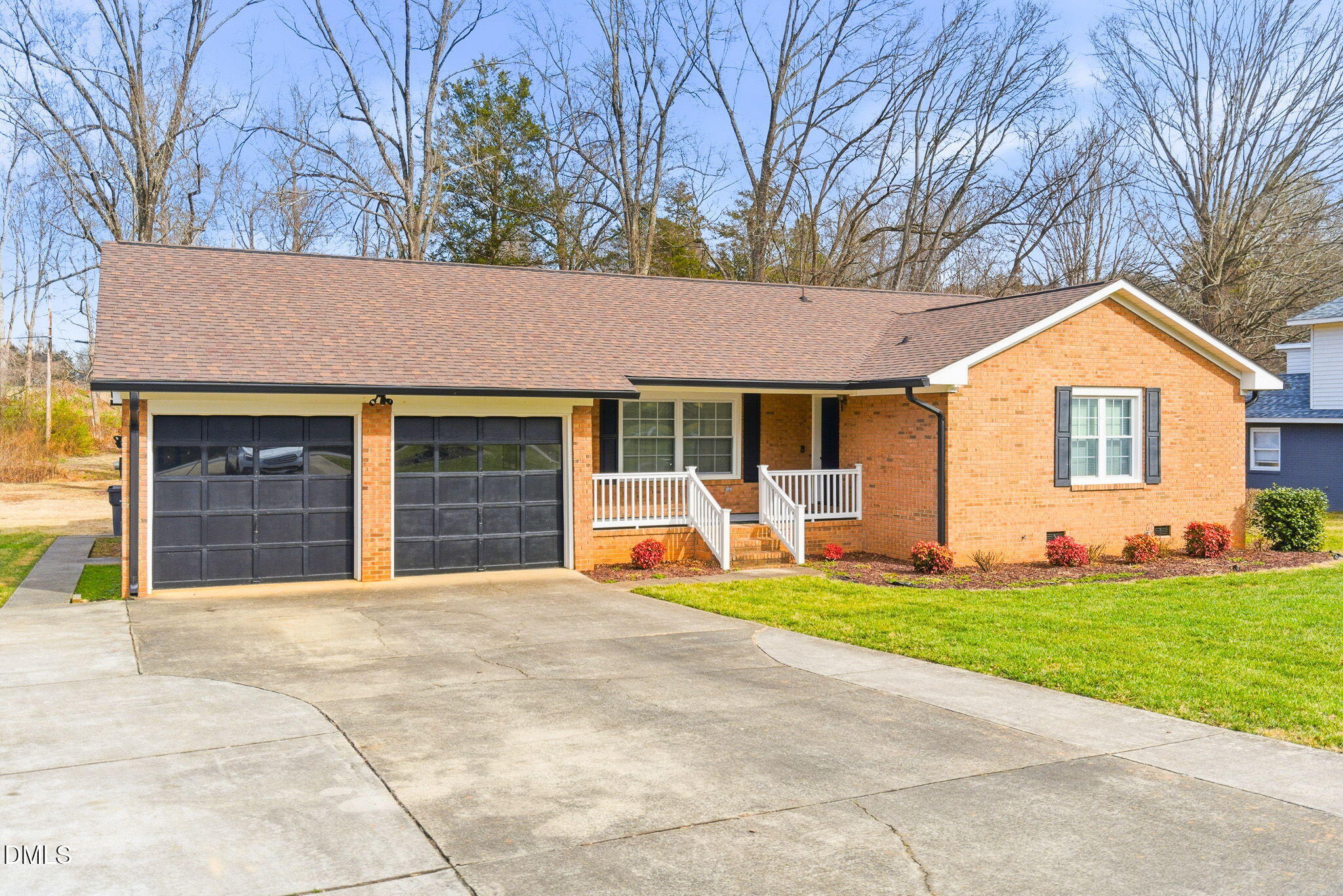1836 Brier Lane Graham, NC 27253 - Photo 2 of 33 a front view of a house with a yard and garage