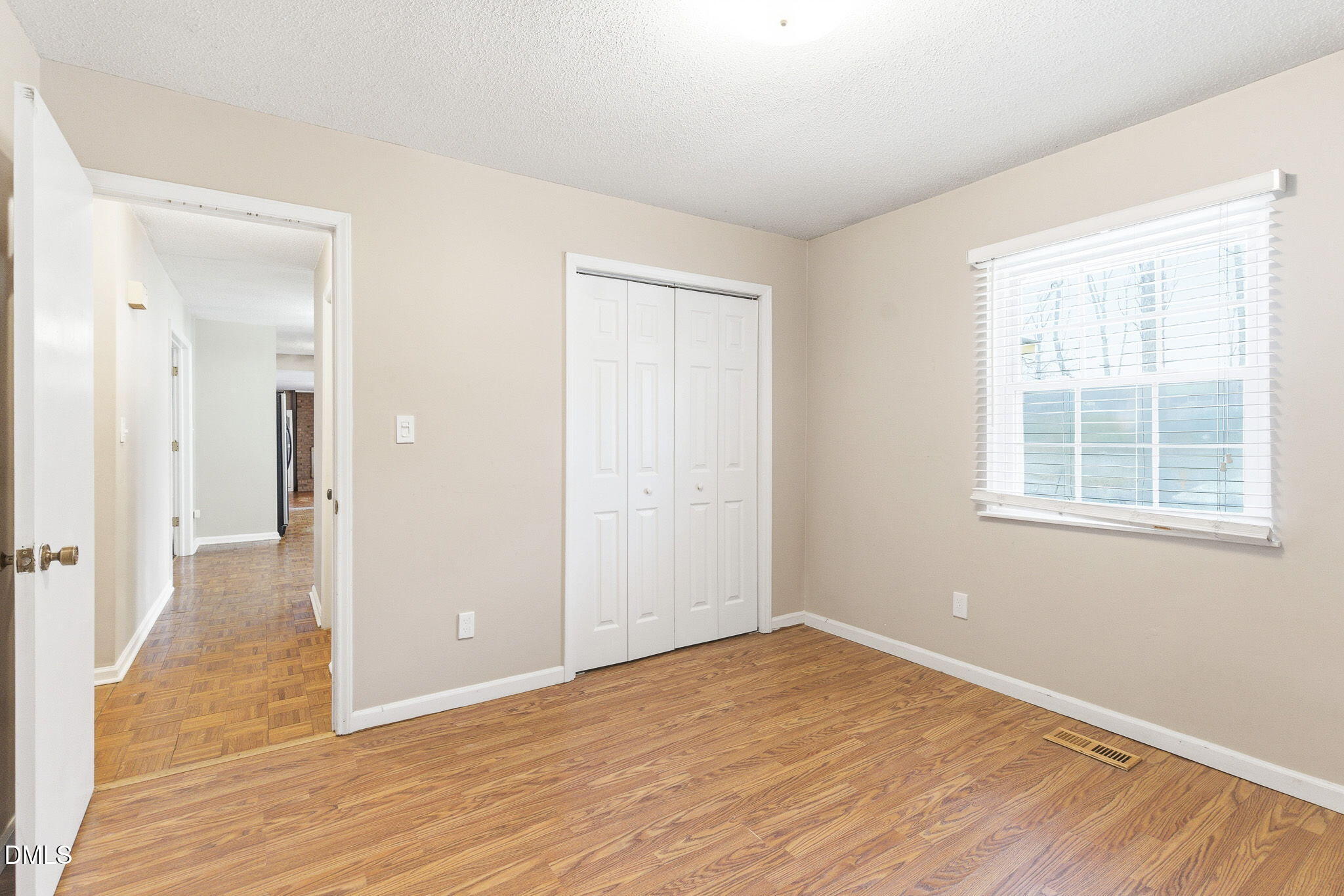 1836 Brier Lane Graham, NC 27253 - Photo 23 of 33 an empty room with wooden floor and windows