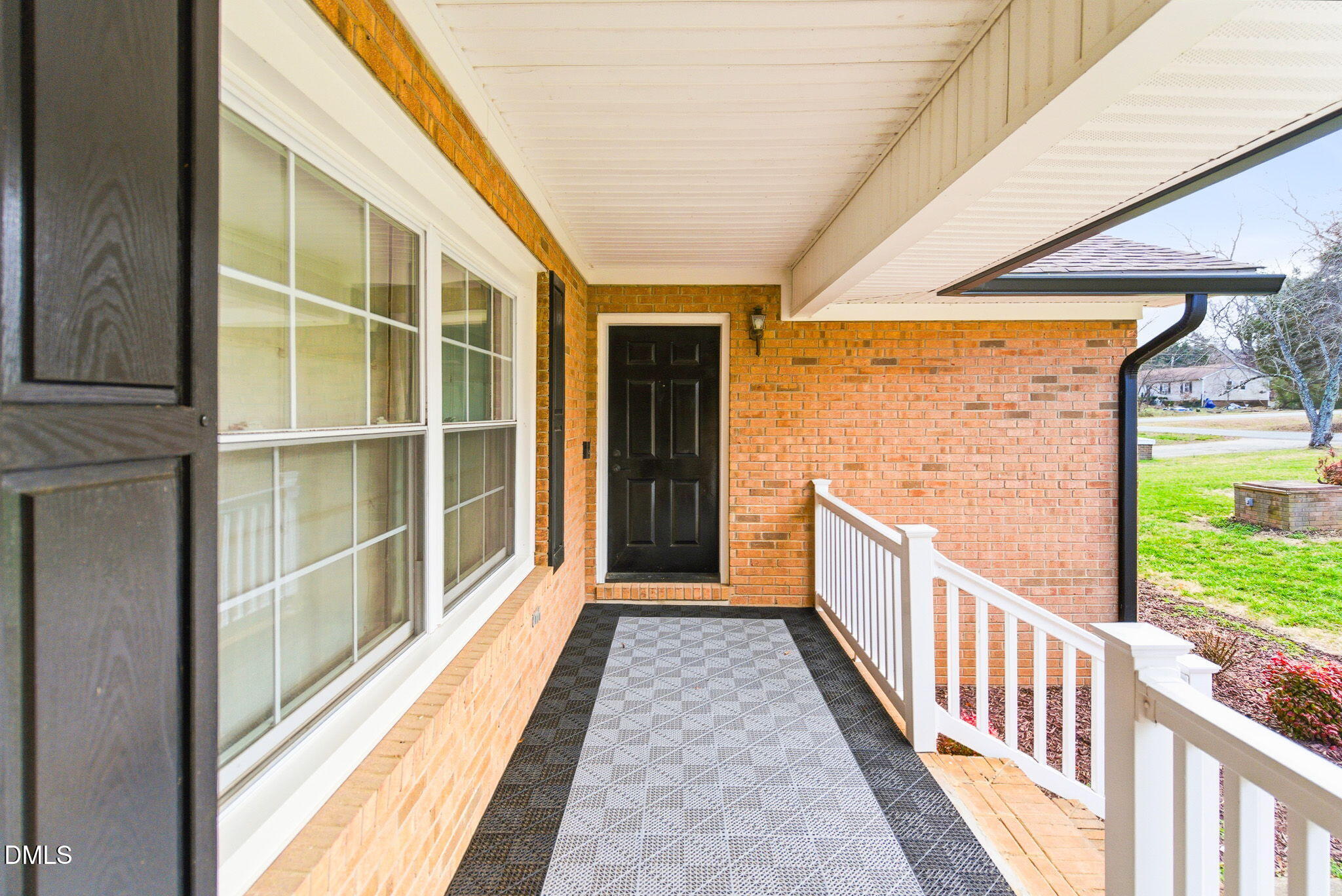 1836 Brier Lane Graham, NC 27253 - Photo 4 of 33 a view of a porch with wooden floor and windows