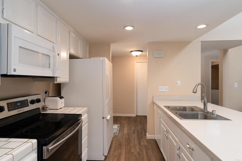 23691 Country Villa Road Ramona, CA 92065 - Photo 4 of 22 a kitchen with a sink stove and refrigerator