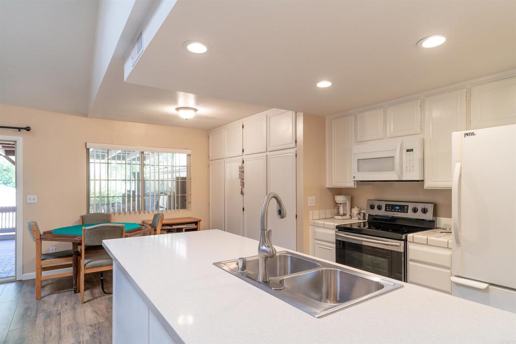 23691 Country Villa Road Ramona, CA 92065 - Photo 5 of 22 a kitchen with kitchen island granite countertop a stove and a sink