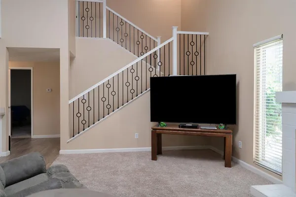 a view of livingroom with furniture and flat screen tv