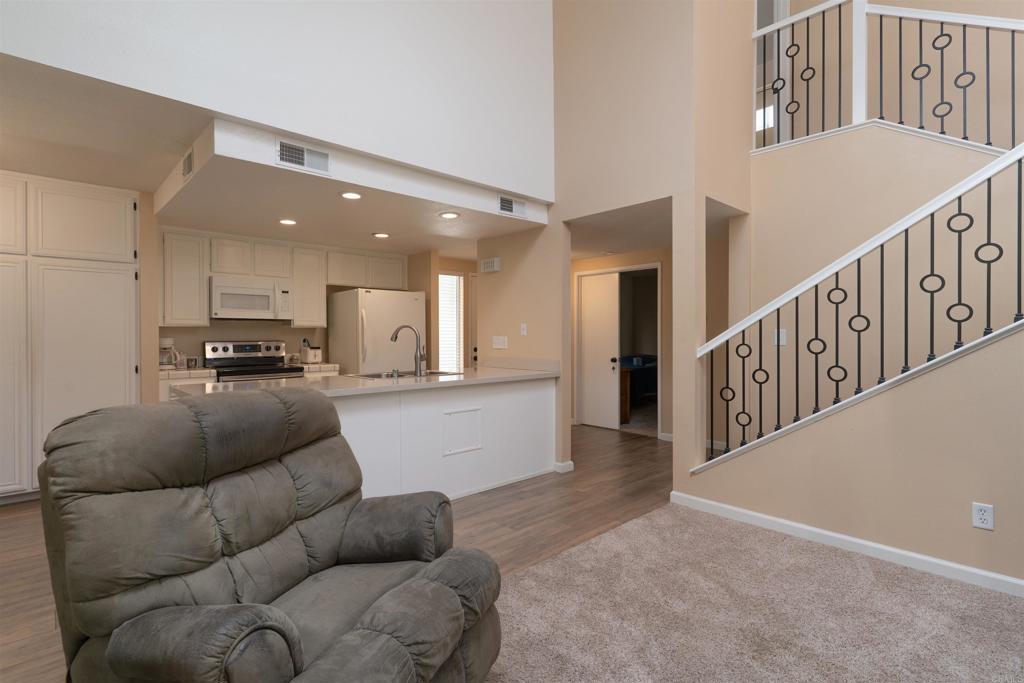 23691 Country Villa Road Ramona, CA 92065 - Photo 8 of 22 a living room with furniture and kitchen view